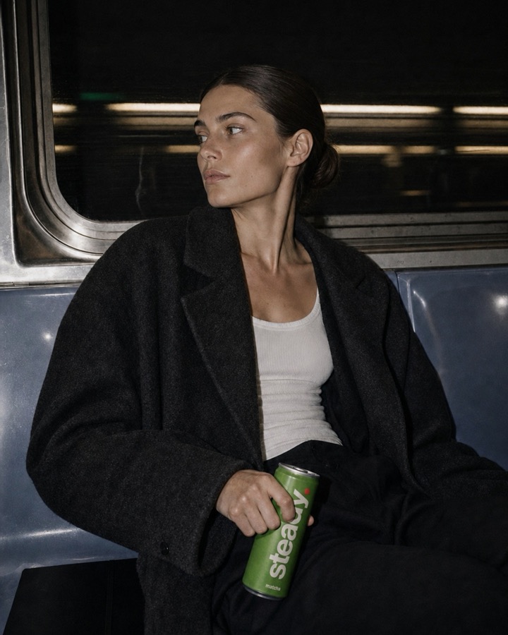 A creator holding a can of Steady